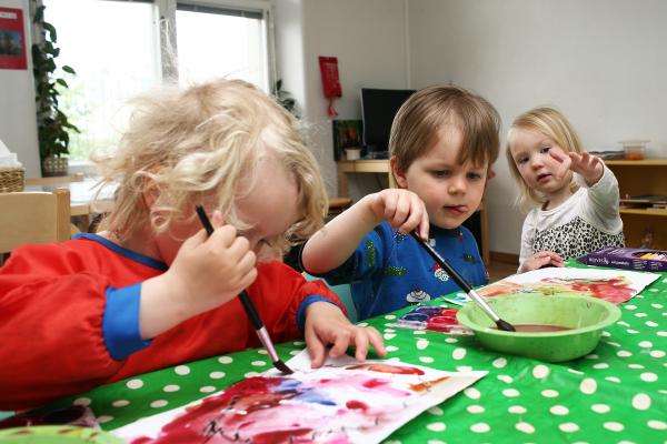 Children painting with water colours