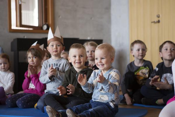 A group of children clapping