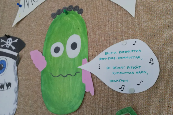 In the picture, there is a drawing of a monster that sings in Finnish.