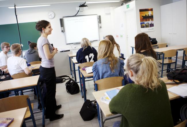 Teacher and elementary school pupils in the classroom