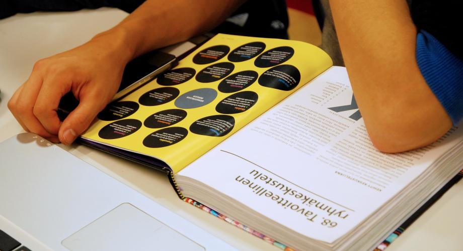 Hands resting on an open textbook