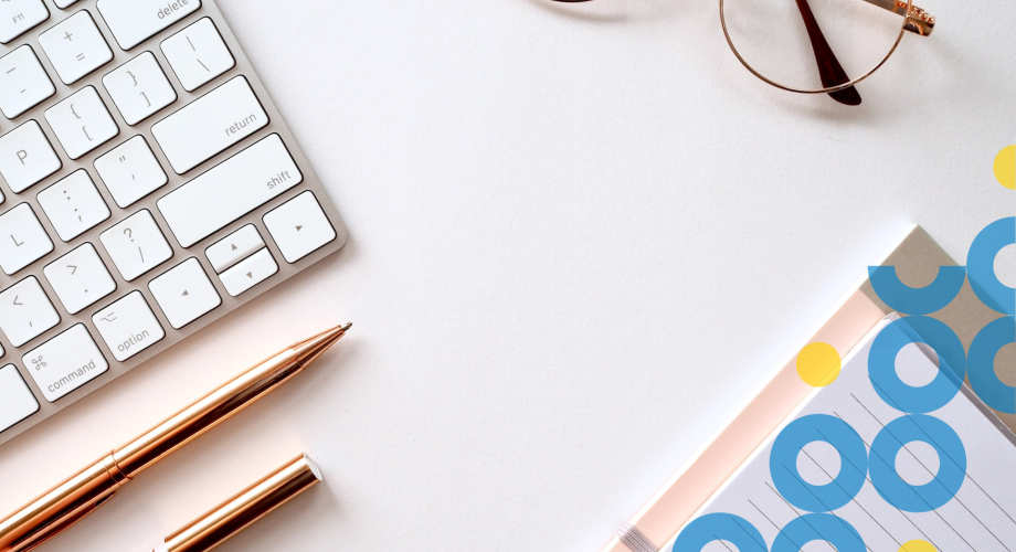 keboard, pen, eyeglasses and notebook on table