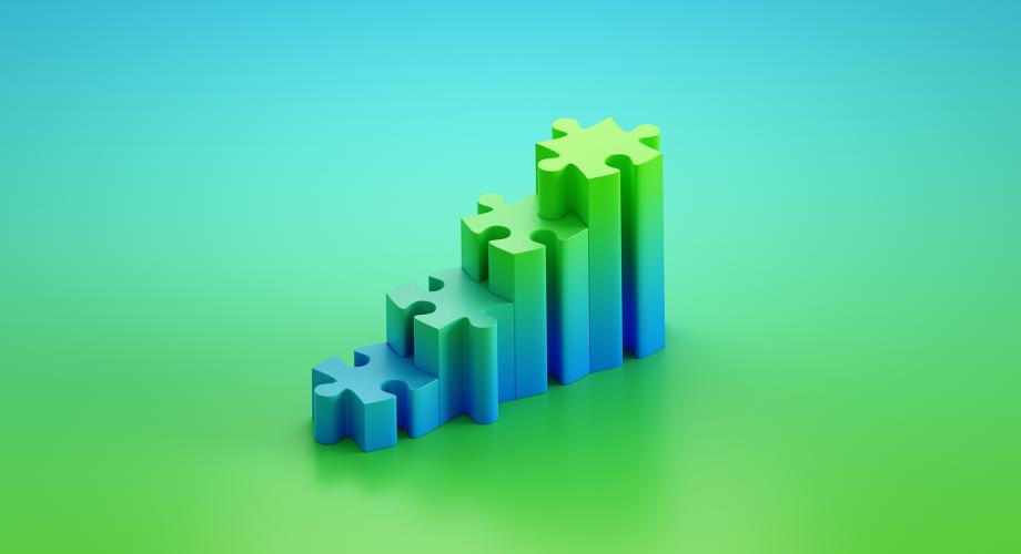 Sini-vihreässä kuvassa on palapelin paloja päällekäin.